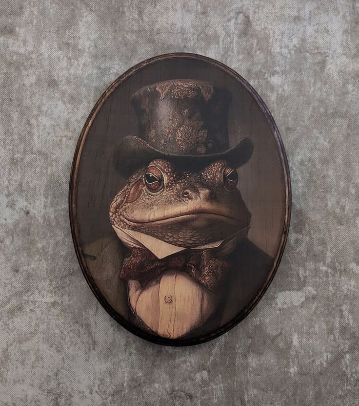 a frog wearing a hat and bow tie with a top hat on it's head