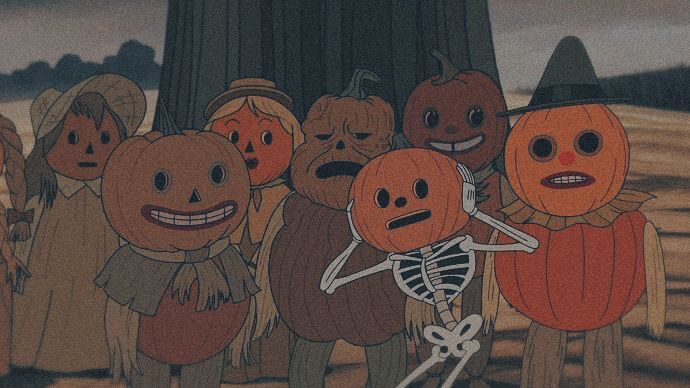 a group of pumpkins standing next to each other