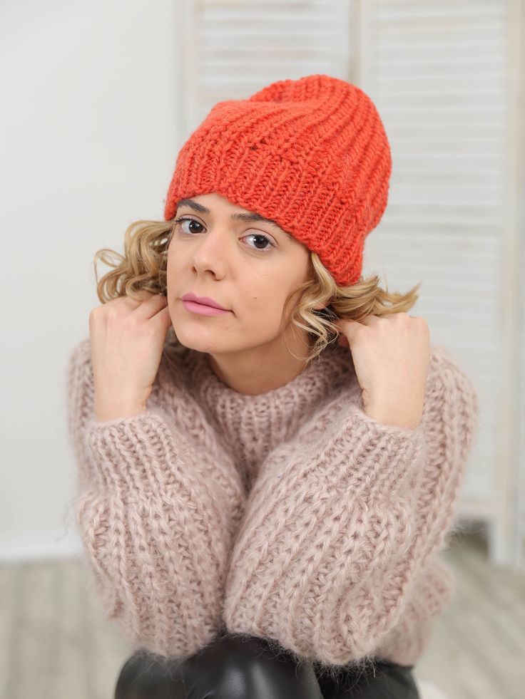 "Make a definite statement with your style by completing a cool outfit with our red mohair knit beanie hat that has a distinctive design that's soft and comfortable. The chunky knit and slightly slouchy fit will make a bold fashionable statement and promise to get you people's compliments. DETAILS - Made from 2 layers of 100 % natural Wool - The model is is wearing size S-М - As mostly all models in our shop the sweater is loose fit - Colour on photo - orange TAKING CARE - Hand wash only - Dry g Fitted Knitted Beanie For Fall, Winter Yarn Bonnet Cap, Knitted Bonnet For Fall, One Size, Knitted Bonnet For Fall, One Size Fits Most, Fitted Knitted Winter Hat, Knitted Fall Bonnet One Size, Winter Crochet Cap Made Of Acrylic Yarn, Fitted Crochet Winter Hat, Slouchy Knitted Solid Beanie