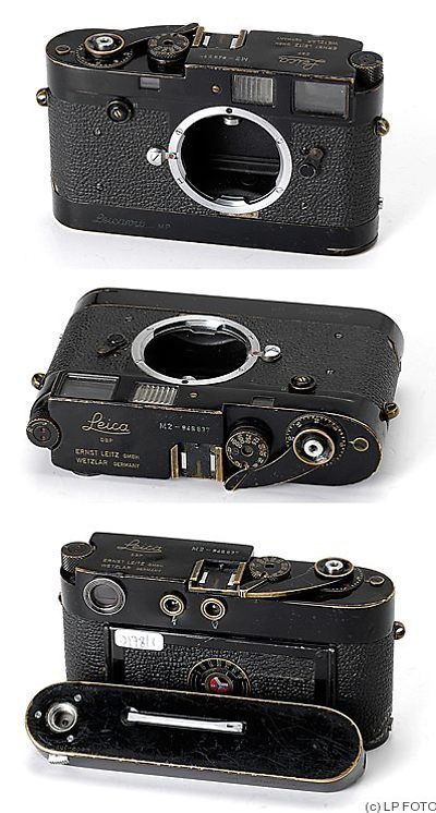 two old cameras sitting next to each other