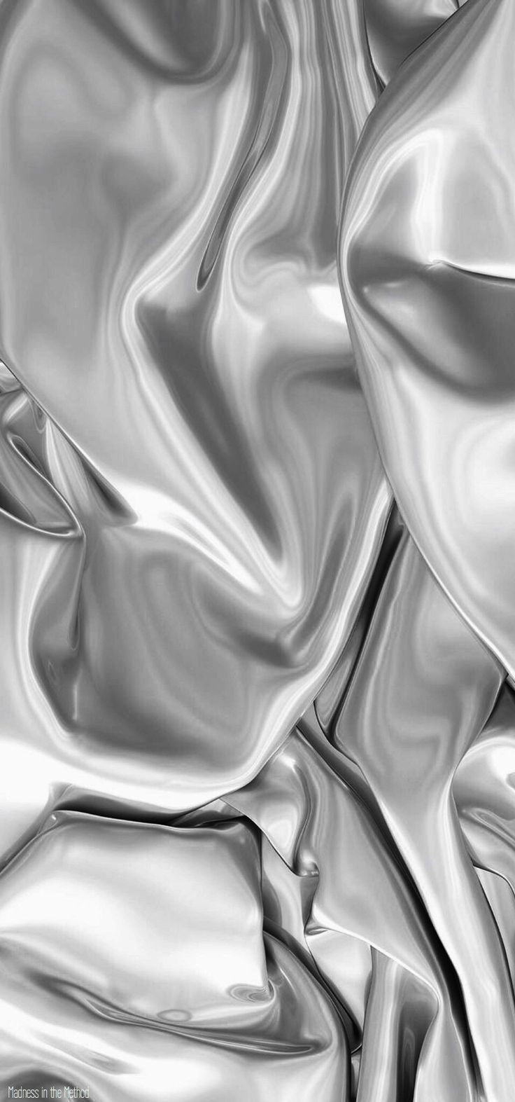 black and white photograph of an abstract silver cloth textured with satine or silk