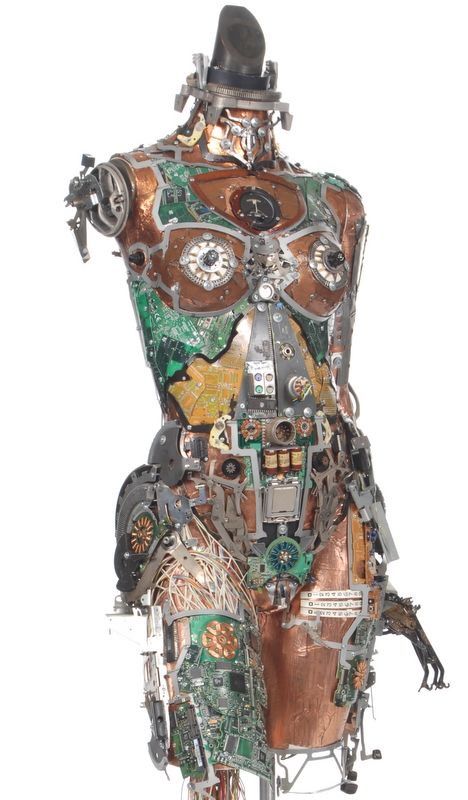 a sculpture made out of assorted metal and glass parts, including a man's torso