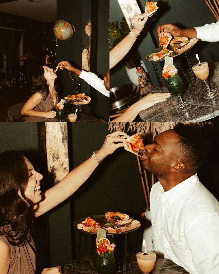 a group of people sitting around a table eating pizza