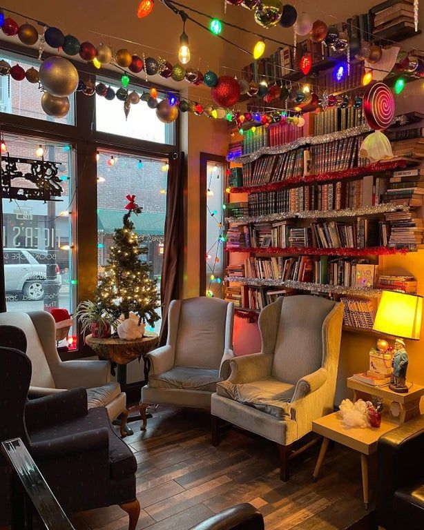 a living room filled with furniture and a christmas tree