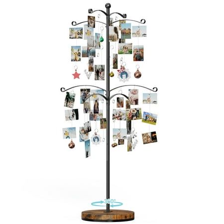 a metal tree with pictures hanging from it's sides on a wooden base and an acrylic stand