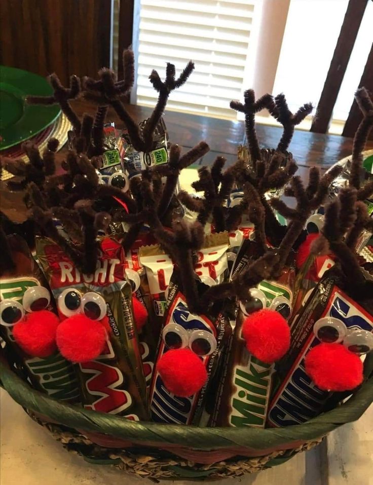 a bowl filled with candy and reindeer antlers