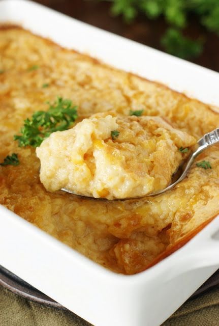 a spoon with some food in it on a plate