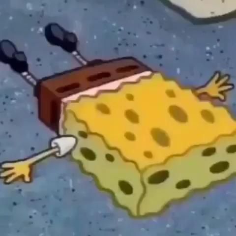 the spongebob character is laying on the ground with his hands up in front of him