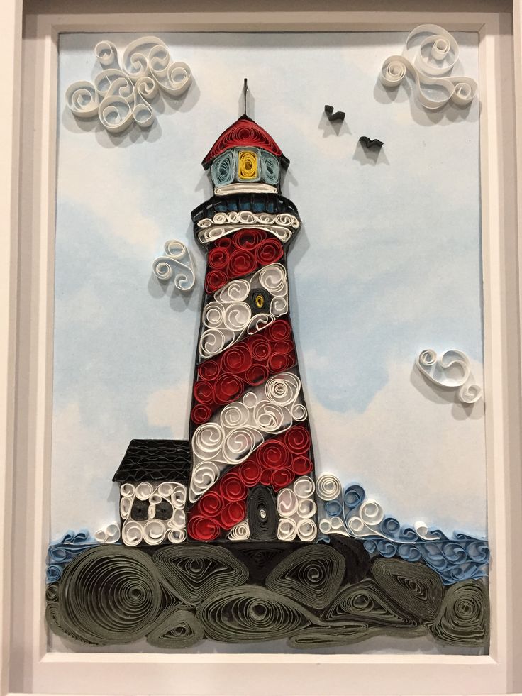 a red and white lighthouse sitting on top of waves