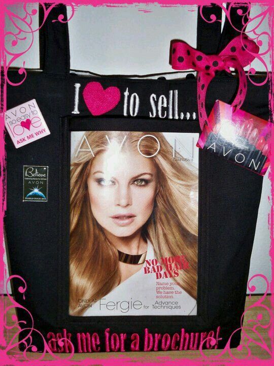 a black tote bag with a pink bow and i love to sell ad on it