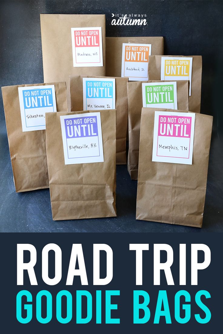 the road trip goodie bags are made from brown paper and have colorful stickers on them