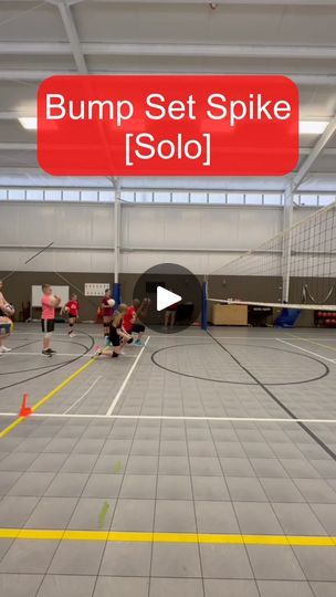 an indoor basketball court with people on it and the words bump set spike solo in red