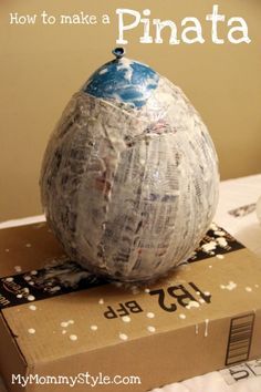 an egg sitting on top of a box with the words how to make a pinata