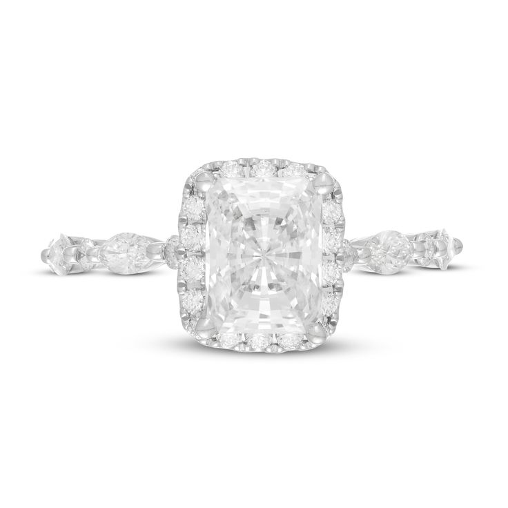 an oval cut diamond ring with diamonds on the band