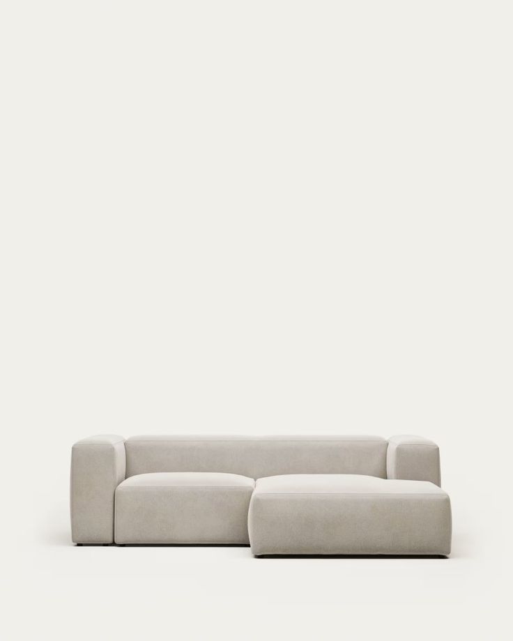 a white couch sitting on top of a floor