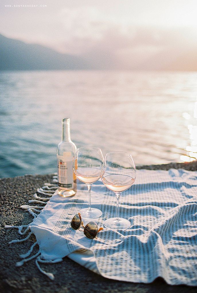 two wine glasses sitting on top of a towel