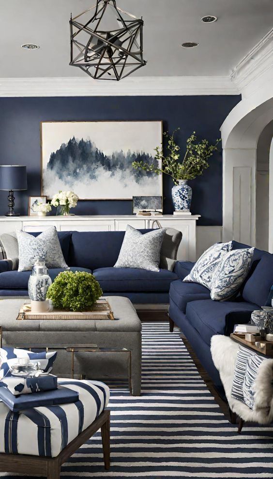 a living room with blue and white furniture, striped rugs and paintings on the wall