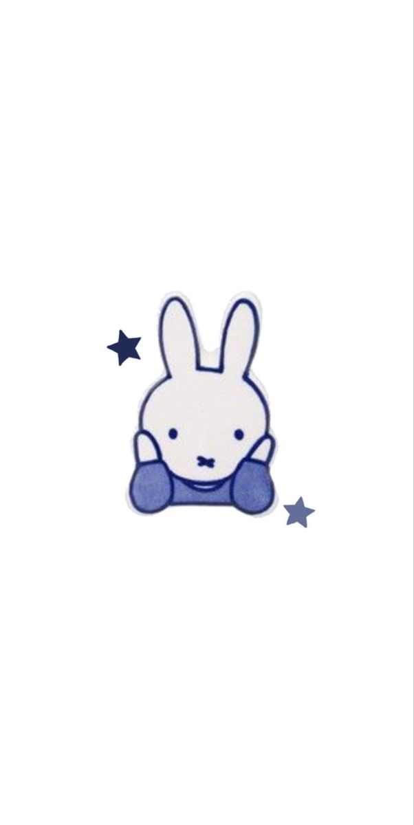 a white rabbit with blue stars on it's chest and head in the air