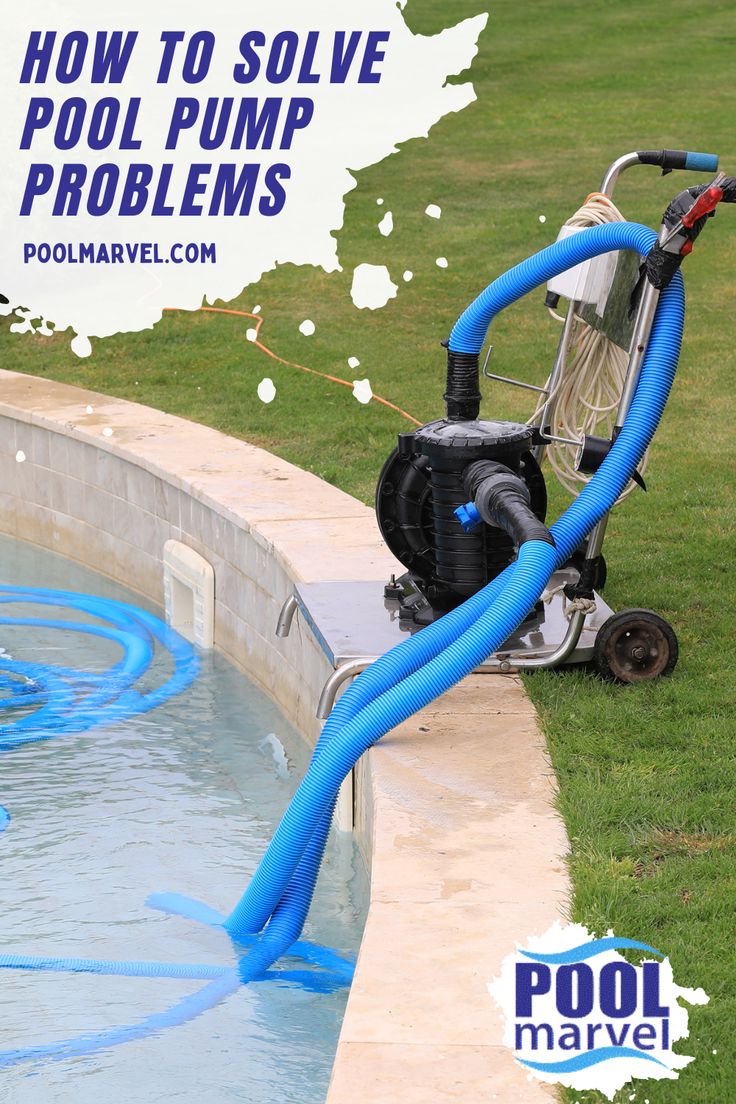 a pool pump is hooked up to the side of a swimming pool with blue hoses