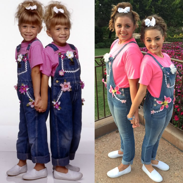 two girls in overalls and pink shirts standing next to each other with flowers on them