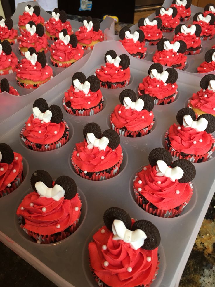 cupcakes with red frosting and minnie mouse ears