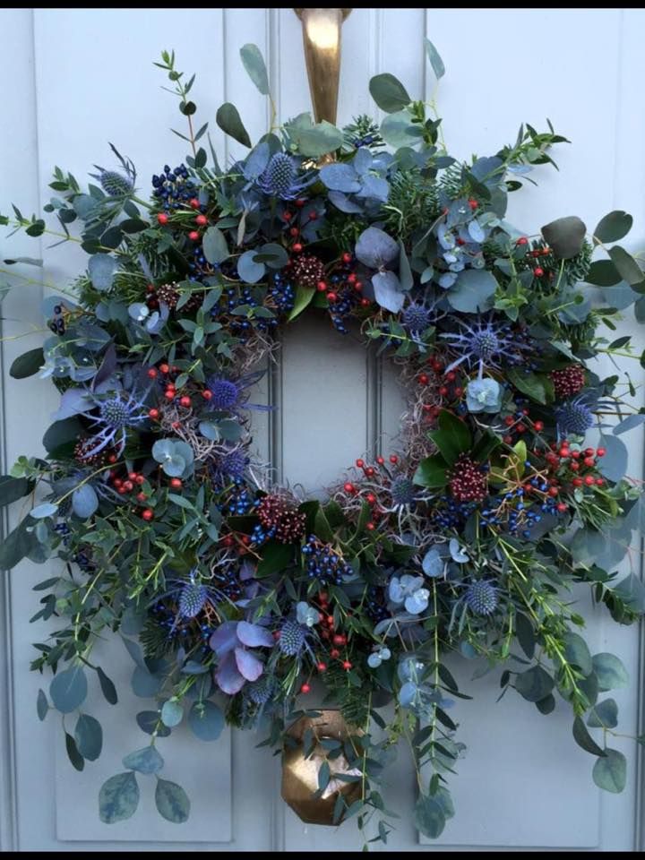 a wreath is hanging on the front door