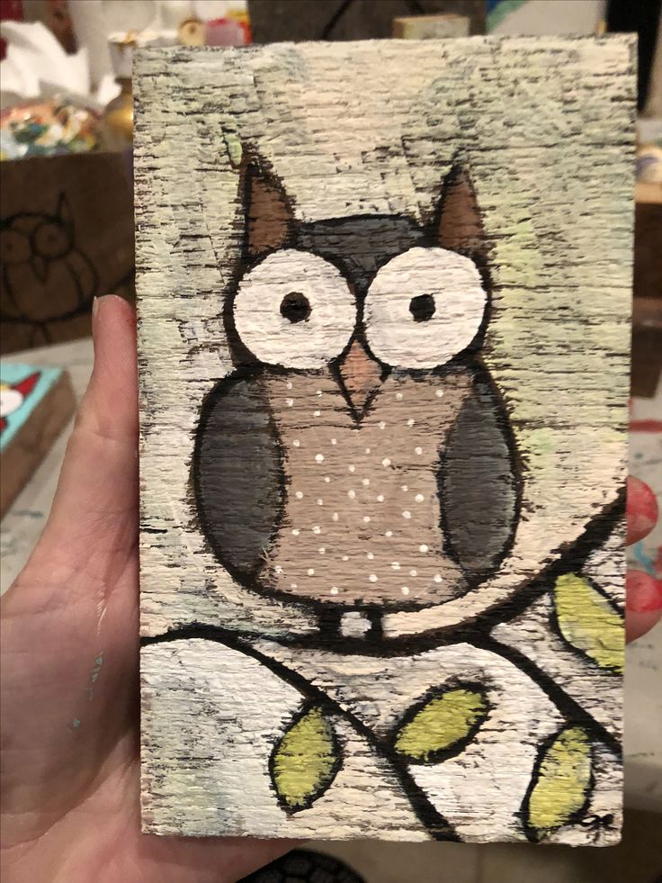 an owl is sitting on a tree branch painted on wood with acrylic paint