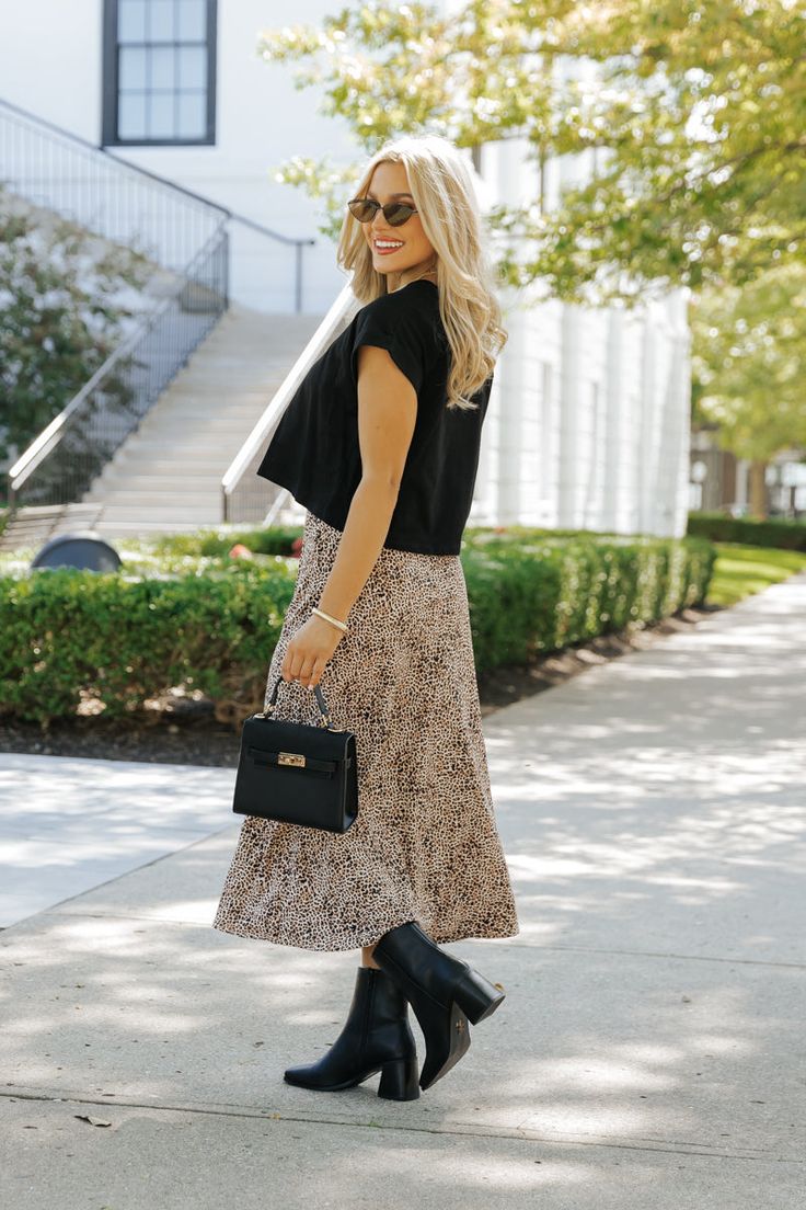 Add a touch of wild flair to your wardrobe with the Brown Leopard Print Midi Skirt! This effortlessly stylish piece combines bold print with a flattering fit, making it perfect for any boho-chic look. Designed with a lightweight fabric, this skirt offers comfort and flow, making it ideal for all-day wear. Pair this skirt with a simple tank, graphic tee, or your favorite cozy sweater for a versatile style that transitions seamlessly from day to night. Leopard Print Midi Skirt, Sorority Rush Outfits, Rush Outfits, Fall Style Guide, Gameday Dress, Casual White Dress, Printed Midi Skirt, Game Dresses, Brown Leopard