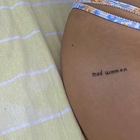 a woman's stomach with the words mad women on it