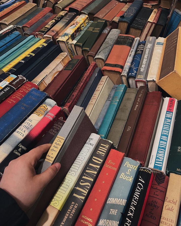 hand picking up a book in a book stack Book Fair Aesthetic, Downtown Boy, Fair Aesthetic, Custom Bookshelves, Book Haul, Crystal Aesthetic, Dark Academia Fashion, Academia Fashion, Boy Aesthetic