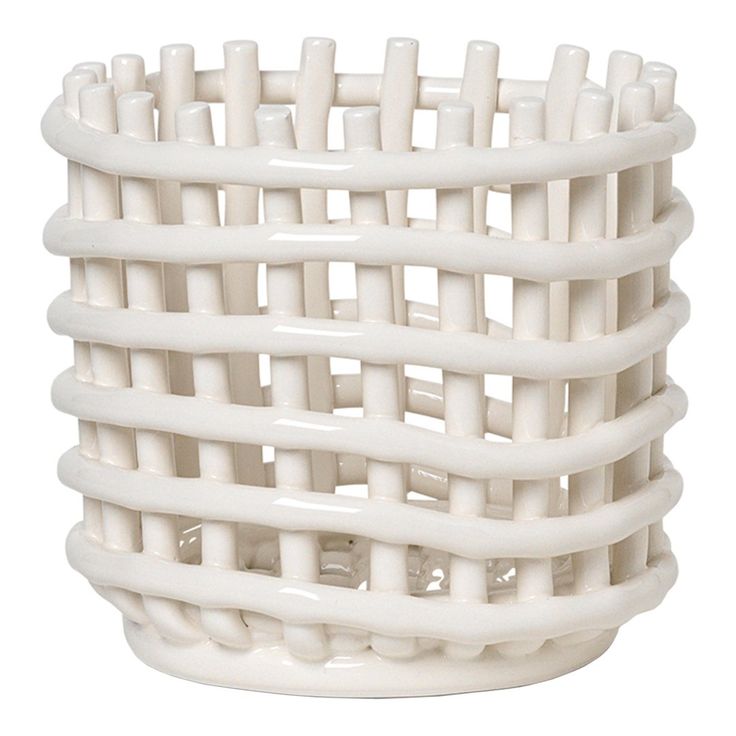 a white basket that is made out of plastic material and has multiple sections in it