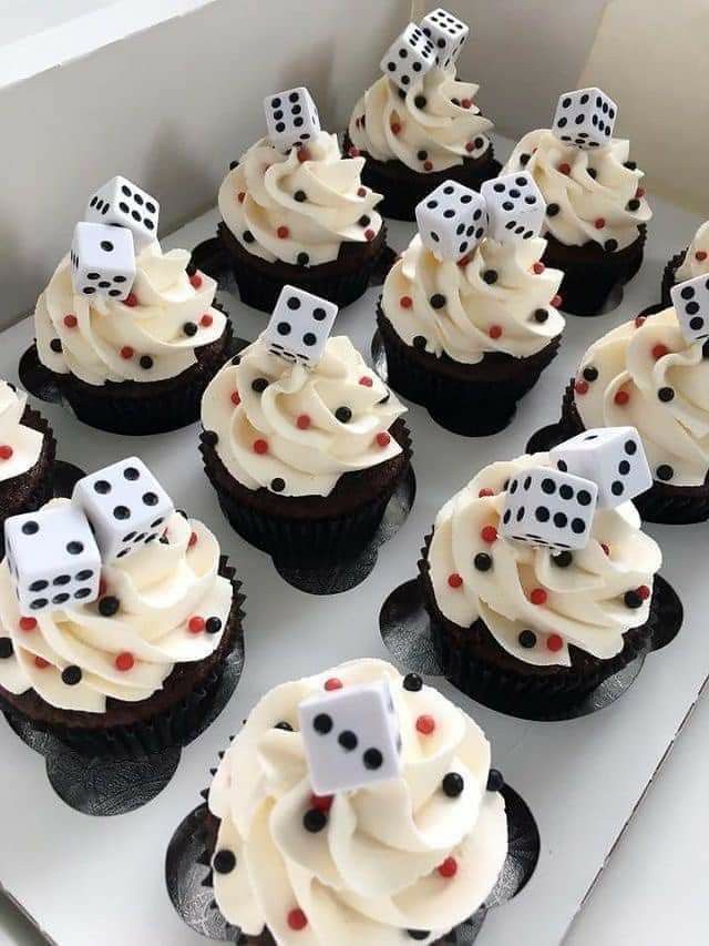 cupcakes with white frosting and dice on top