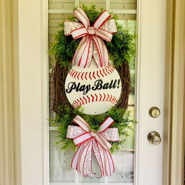 a baseball wreath is hanging on the front door