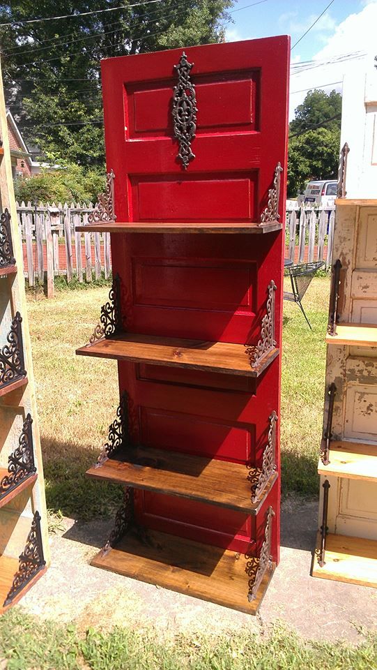 an old red door is turned into a shelf