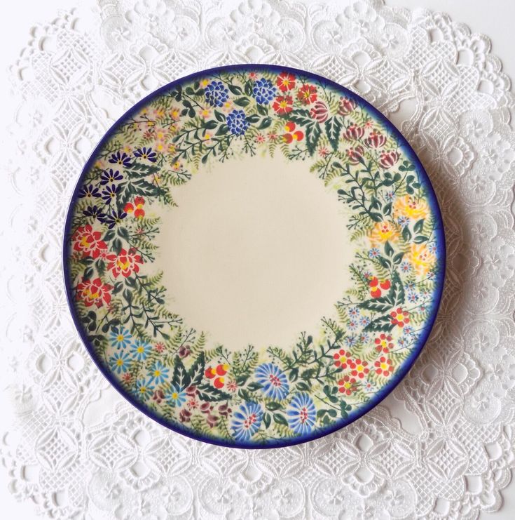 an empty plate on a white doily