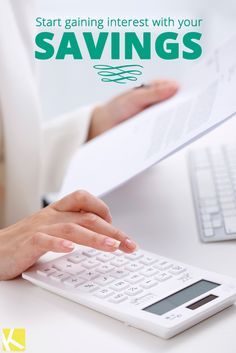 a woman typing on a calculator with the words savings written above her hand