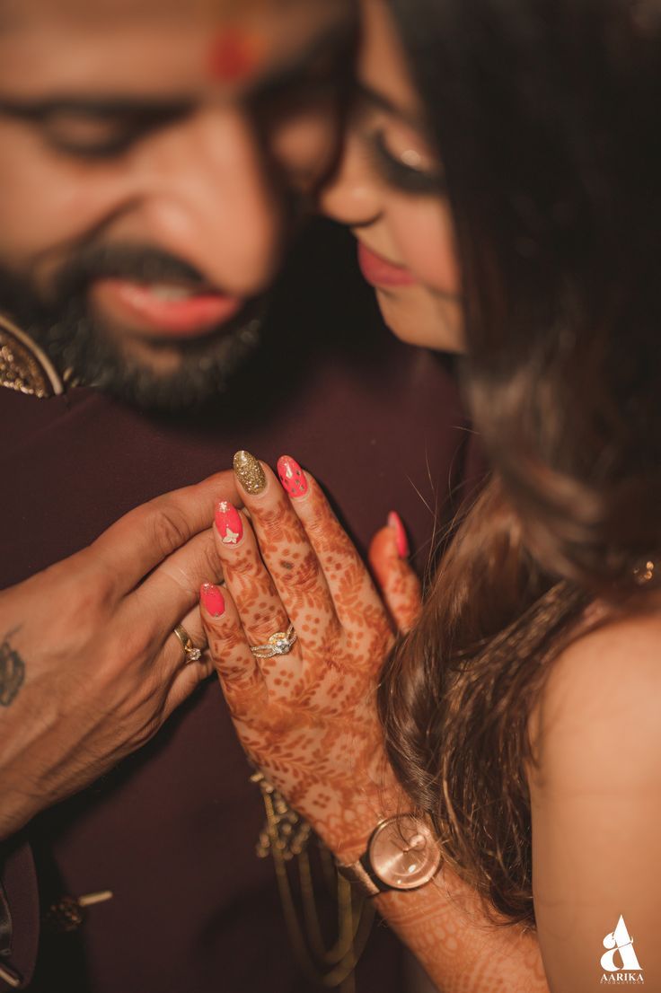 a man and woman holding each other's hands