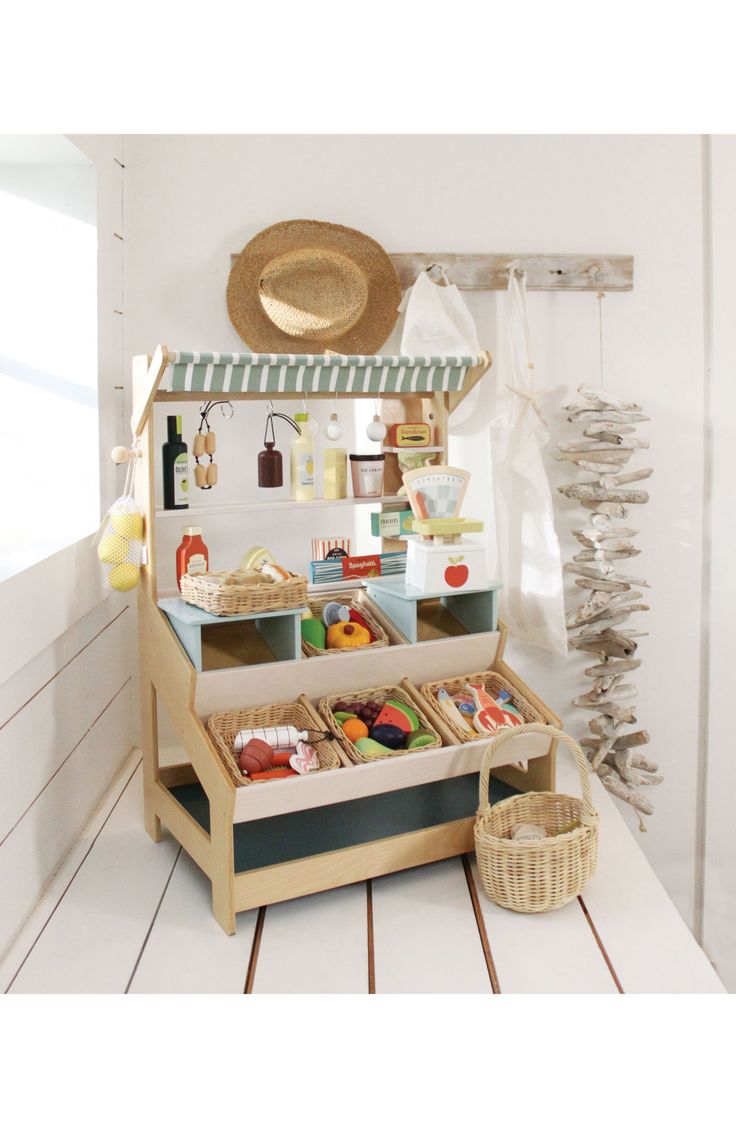 a toy kitchen with lots of food in it