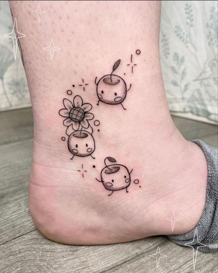 a small tattoo on the foot of a woman