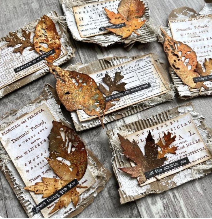 four pieces of altered paper with leaves on them