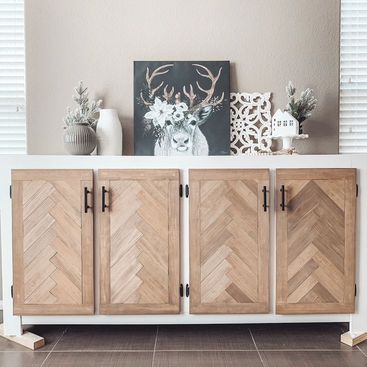 the sideboard is made out of wood and has two doors on each side, one with