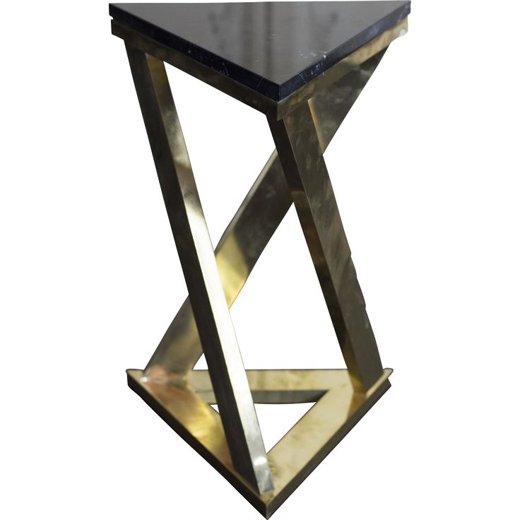 a black and gold side table with an x design on the top, against a white background