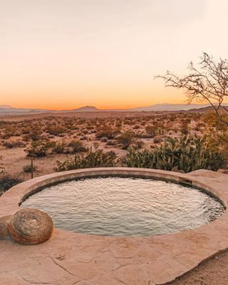 a hot tub sitting in the middle of a desert