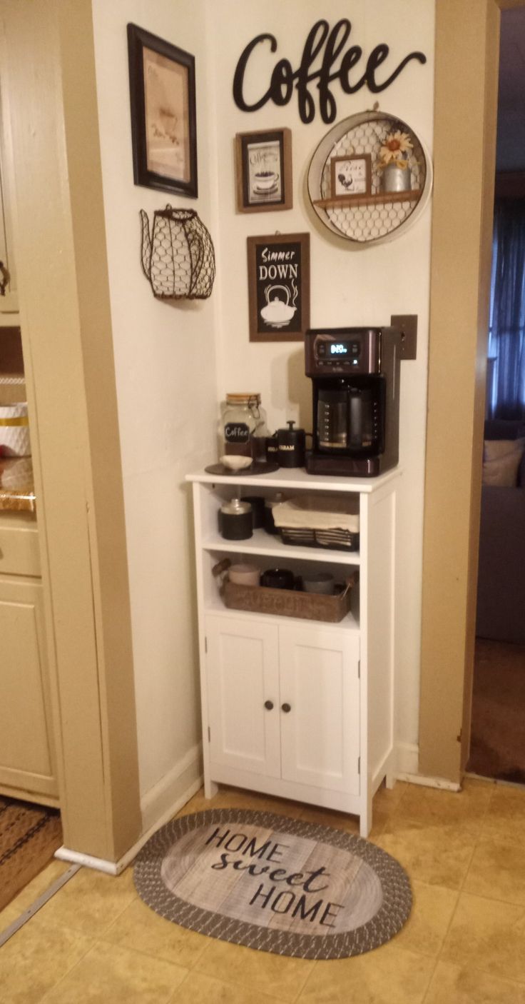 I have a very open area, so I chose the only open corner I have for my coffee bar. I then found a cabinet that would fit, and my bar came together.  I love that their are doors at bottom where I can store extra coffee, creamer, etc. Coffee Corner In Small Kitchen, Kitchen Countertop Coffee Bar Ideas, Coffee Corner Home Ideas, Small Coffee Bar Ideas Diy, Ideas Para Cafe Bar En Casa, Corner Keurig Station, Narrow Coffee Bar, Cooffe Style Corner, Keurig Corner Counter