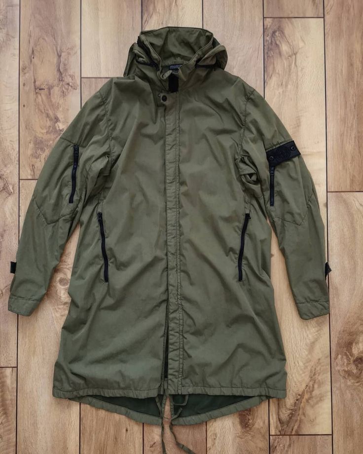 Stone Island Shadow Project Parka Concealed hood folded down. 52197007 #stoneislandshadowproject Man Piercing, Stone Island Parka, Terrace Fashion, Football Casual Clothing, Navi Outfits, Techwear Outfits, Fishtail Parka, Stone Island Shadow Project, Duffle Coat