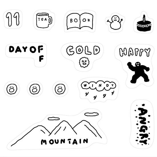 some stickers that are on the side of a white paper with words and symbols