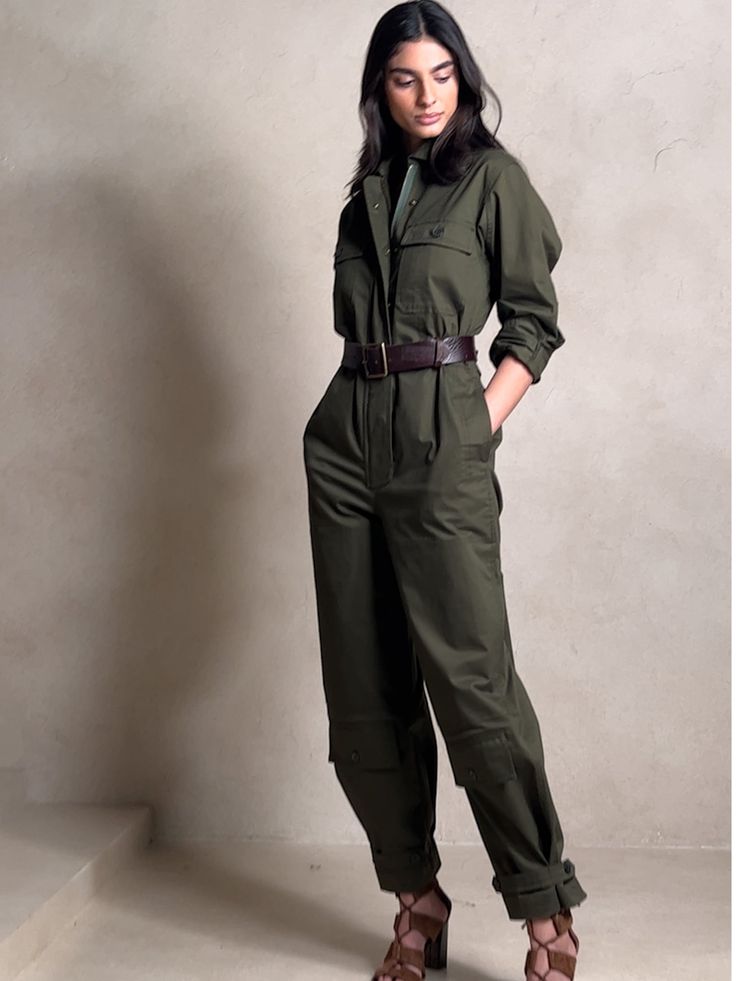 Ready for adventure, this utilitarian jumpsuit takes inspiration from archival styles with reinforced panels at the knees, topstitch detailing, pockets at the shins and a luxurious-yet-sturdy twill fabric of cotton, enhanced with a touch of stretch f Fitted Cargo Style Jumpsuits For Spring, Cotton Jumpsuits With Side Pockets For Fall, Khaki Utility Jumpsuit With Pockets, Cargo Style Jumpsuits And Rompers For Spring, Fitted Cargo Style Jumpsuits And Rompers For Spring, Spring Cargo Style Fitted Jumpsuits And Rompers, Fitted Utility Jumpsuit With Pockets, Utility Style Khaki Jumpsuits And Rompers With Pockets, Cotton Jumpsuits And Rompers With Side Pockets For Fall