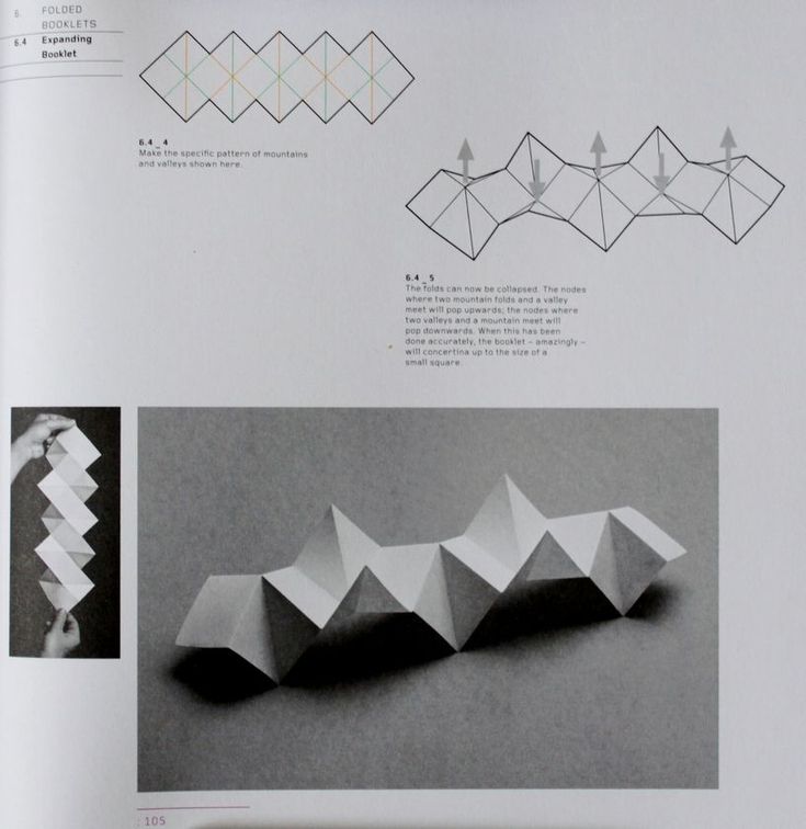 an open book with some origami on the page and pictures of different shapes