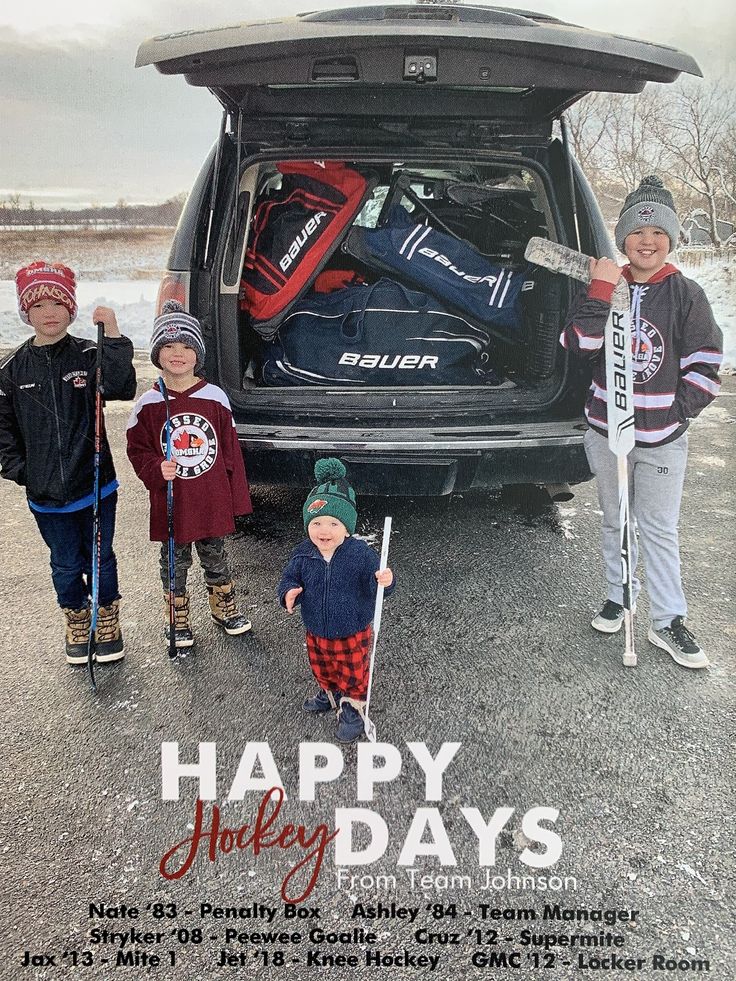 three children standing in front of an open car trunk with hockey gear on the back