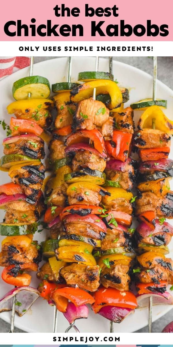 the best chicken kabobs on a white plate